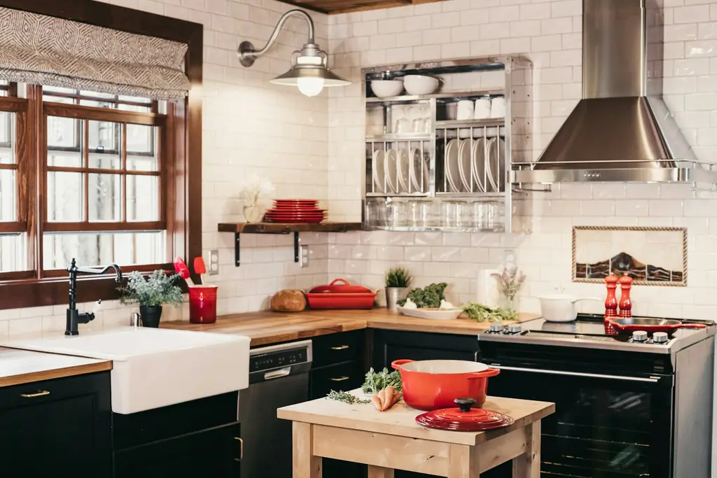 Dark kitchen cabinets beside a tile backsplash
