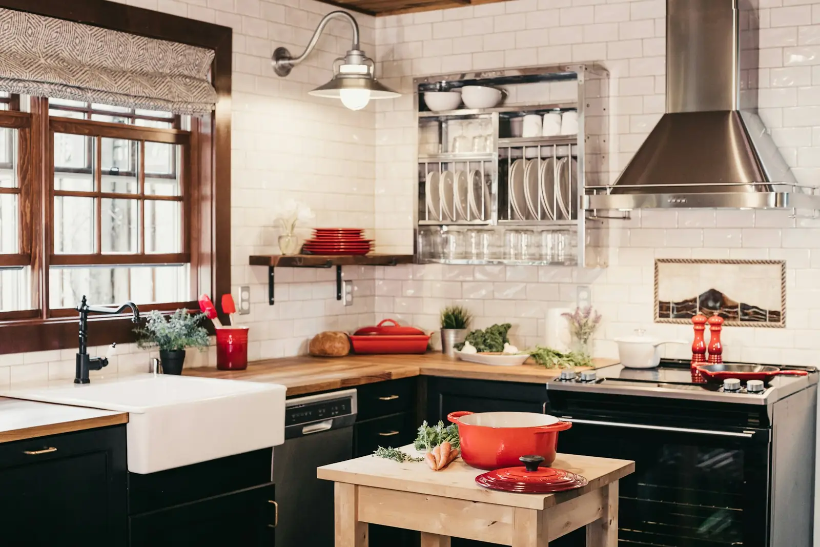 Dark kitchen cabinets with a white sink and tile backsplash